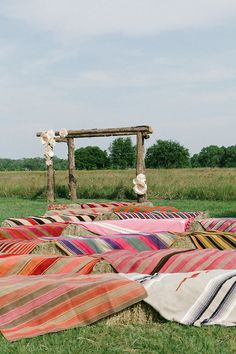 a bunch of blankets that are laying on the ground