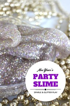 there is a purple and silver party slime on the table with beads around it