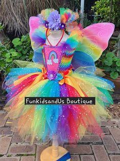 a colorful tutu dress on top of a mannequin