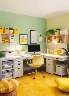 a home office with yellow carpet and green walls