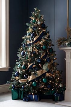 a christmas tree decorated with blue and gold ornaments