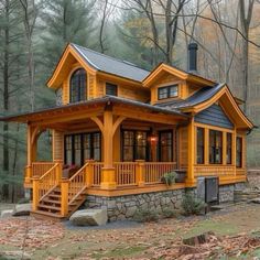 a small yellow house in the woods