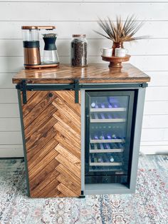 a wine cooler sitting on top of a wooden counter