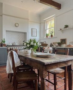 the kitchen is clean and ready to be used for cooking or dining room table with chairs