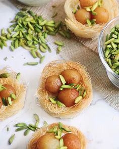 small bowls filled with food sitting on top of a table