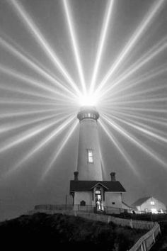 the light is shining brightly over the lighthouse