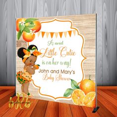 an orange themed baby shower is featured in this photo with the name and age on it