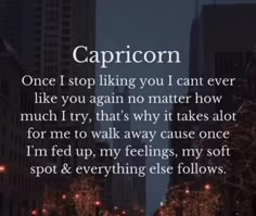 a city street at night with the words capricon written in front of it