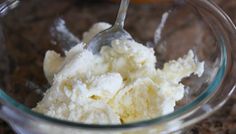 a glass bowl filled with ice cream on top of a counter