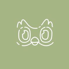 a cat's face drawn in white on a green background with the words,