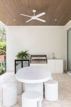 A bright and open outdoor living area and kitchenette features brushed brass tapware and a white outdoor table setting. Outdoor Renovation Ideas, Outdoor Countertops, Timber Lining Boards, Outdoor Countertop, Abi Interiors, Outdoor Renovation, Add Value To Your Home, Timber Ceiling, Renovation Ideas