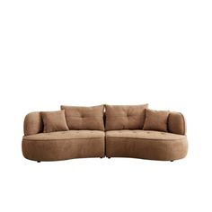 a large sectional couch with pillows on it's back and arms, sitting in front of a white background