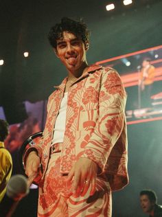 a man standing in front of a microphone