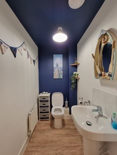 Painted ceiling 
Downstairs toilet
Navy blue and white bathroom
Nautical bathroom 
Home decor
Home inspo
Plants
Bunting
Wall mirror Bathroom Blue Ceiling, Navy Blue Ceiling, Navy Blue Bathroom Ideas, Navy Blue Bathroom Walls, Landscape Renovation, Blue Ceiling, White Toilet