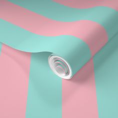 a pink and blue striped wallpaper with a white circle