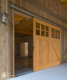 an open garage door on the side of a building