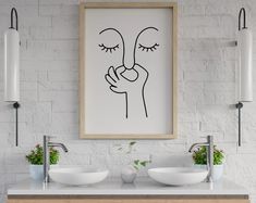 a bathroom with two sinks and a painting on the wall above it that says'i love you '