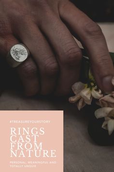 a person is holding a ring with flowers in front of them and the words rings cast from nature on it