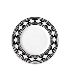 a black and white plate sitting on top of a table