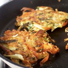 some food is being cooked in a skillet on the stove and ready to be eaten