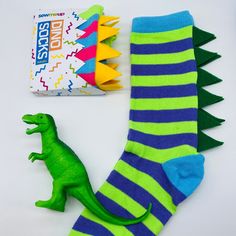 🦖 How fun are these novelty Dinosaur unisex socks, with felt spikes?  Be a big kid on your own or join in with your child and enjoy twinning it with matching socks ... (Also available in younger children's sizes) https://www.etsy.com/uk/listing/1006641052/kids-dinosaur-socks-kids-personalised You'll have hours of fun wearing these fab colourful socks and you'll definitely stand out in the crowd. 🦖 A fun idea for all your bachelors at your wedding or for a quirky and fun gift for that someone special. Socks will come packaged in a cool card design, if you'd like your packaging personalised then please check out my personalised sock listing.   Please note that sizes are in UK size 6-11  *Please note: Socks may vary slightly to the colours in the photos. This will either be a slightly diffe Adult Dinosaur Slippers, Cute Dino Socks, Funky Kids Xmas Socks, Playful Cheap Socks For Playtime, Wacky Socks For Boys, Stocking Fillers For Adults Uk, Socks Dinosaur, Mens Colorful Socks, Dinosaur Socks