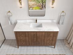 a bathroom with a sink, mirror and rug