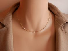 dainty gold choker dainty pearl choker gold rosary choker gold chain choker necklace gold satellite chain gold satellite necklace A beautiful pearl necklace on a satellite chain. Five freshwater pearls and a satellite chain make this necklace of a beautiful and elegant jewel! It can be made on a sterling silver or gold vermeil chain. Please, message me if you want a specific length that is not shown in the menu or if you are not sure of the length. Pearls may have imperfections as they are natur Gift Pearl Necklace With Satellite Chain, Delicate 14k Gold Filled Choker, Delicate Gold Plated Jewelry With Satellite Chain, Dainty Pearl Choker Jewelry, Dainty Pearl Necklace With Pearl Chain, Elegant Gold Pearl Necklace With Satellite Chain, Dainty Pearl Charm Choker Jewelry, Dainty Gold Plated Pearl Necklace With Delicate Chain, Dainty Pearl Pendant Choker