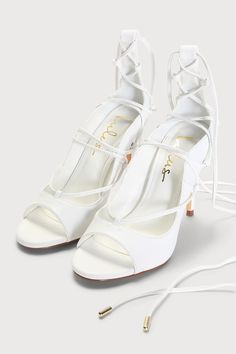 Keep it classy when you step out on the town in the Lulus Sayela White Lace-Up High Heels! Smooth faux leather shapes these chic-as-can-be heels that have a open toe upper that rises to a gently curved collar. Lace-up vamp has long laces with gold aglets that wrap and tie above the ankle. Classic stiletto heel finishes the look! 4" wrapped stiletto heel. Cushioned insole. Rubber sole has nonskid markings. All Man made materials. Imported. Lulus | Sayela White Lace-Up High Heels | Size 6.5. White High Heels, Lace Up High Heels, Lulu Fashion, Keep It Classy, Peep Toe Heels, Ankle Straps, Stiletto Heel, White Lace, Stiletto Heels