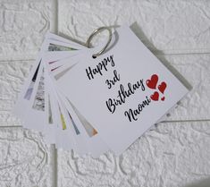 a bunch of cards that have been placed on a white surface with the words happy 3rd birthday namism written on them