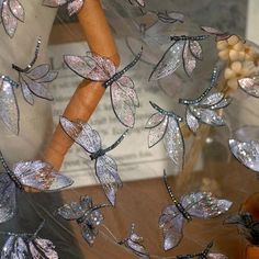 a close up view of some glass butterflies