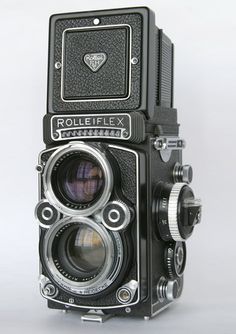 an old fashioned camera is shown on a white background