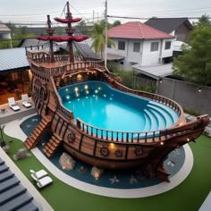 an above ground swimming pool with a pirate ship on the deck and stairs leading up to it