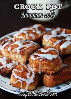 cinnamon rolls on a plate with icing drizzled over them and the words crock pot cinnamon rolls