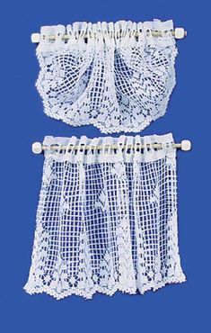 two pieces of white lace on a blue background