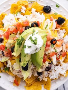 a white plate topped with nachos and rice