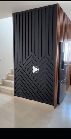 a room that has some stairs and a door on the wall in front of it