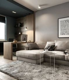 a living room filled with furniture next to a window and a rug on the floor