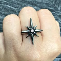 Beautifully crafted full of details Starburst ring is perfect for both men and women. Ring is made of 316L Stainless Steel and has some oxidation. Ring is set with black Cubic Zirconia stone. North Star 25mm long X 20mm wide We ship in a gift box. Black Star Jewelry, Star Themed Outfits, North Star Ring, 4 Point Star, Star Rings, Starburst Ring, Space Rings, Gothic Ring, Moon And Star Ring