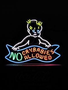 there is a neon sign that says no crybabies allowed on the front of it