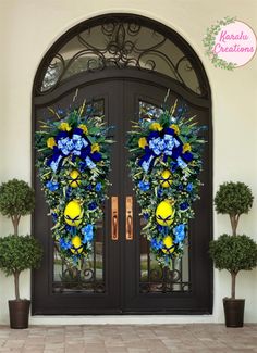 the front door is decorated with blue and yellow flowers