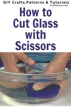 a person using scissors to cut glass with scissors in a bowl on top of a table