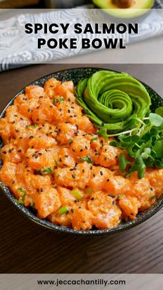 spicy salmon poke bowl with avocado on the side