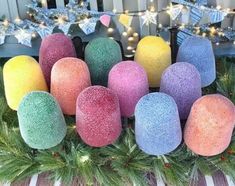 several colored balls are sitting in the grass