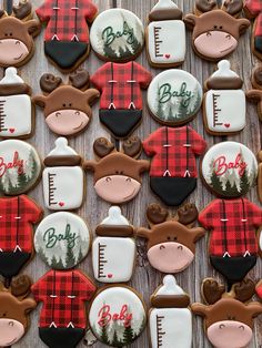 decorated cookies are arranged in the shape of teddy bears and deers with plaid shirts on them