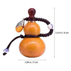 an orange object with a wooden handle and braided cord around it's neck