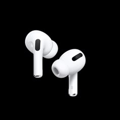 two white ear buds sitting next to each other on a black surface with the same color