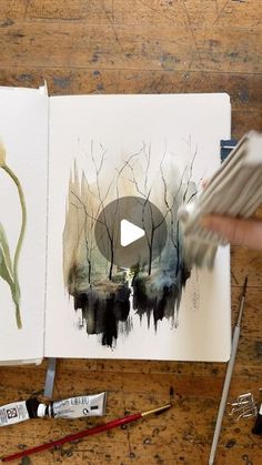 someone is painting an image with watercolors on paper and then it's being colored