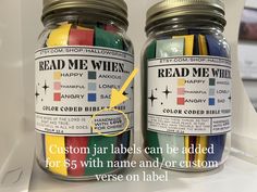 two jars filled with different colored labels next to each other