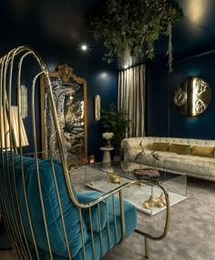 a living room with blue walls and gold accents