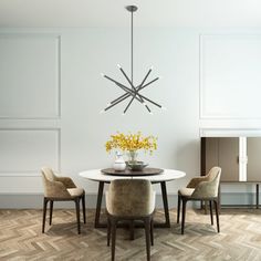 a dining room table with four chairs and a vase on the center piece, in front of a white paneled wall